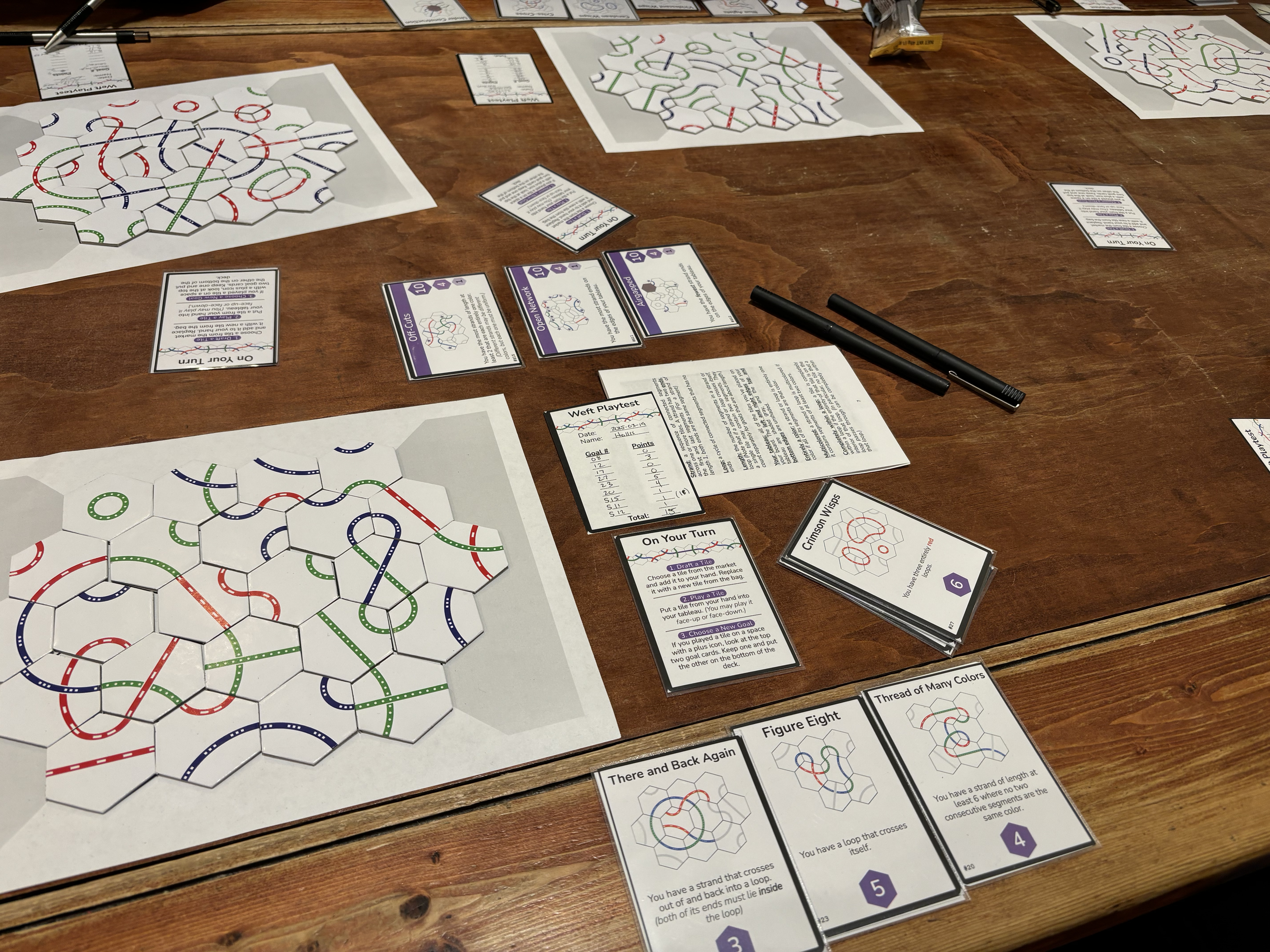 A finished game of Weft spread across a table